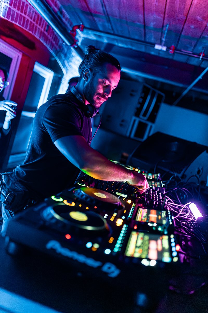 Max Lagardi at the mixer in the purple light